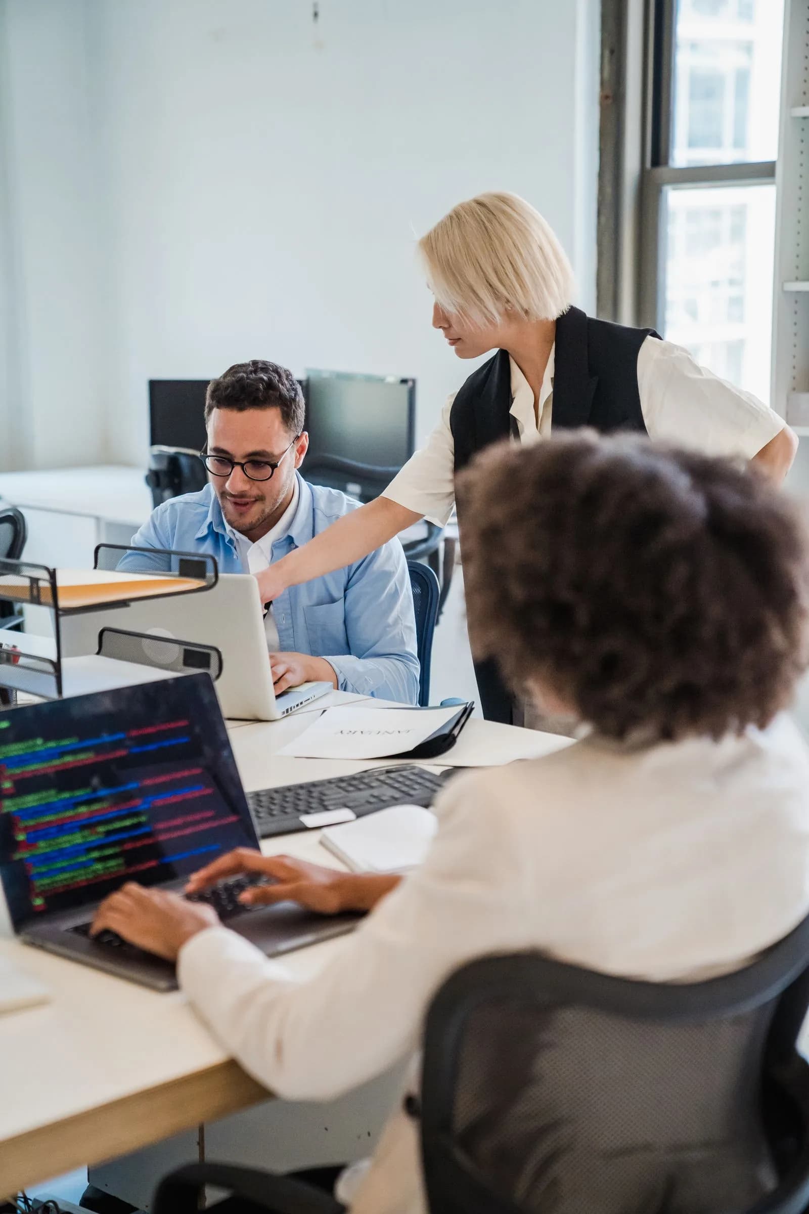 Team collaborating with software — B2B SaaS & Technology marketing by TML Agency