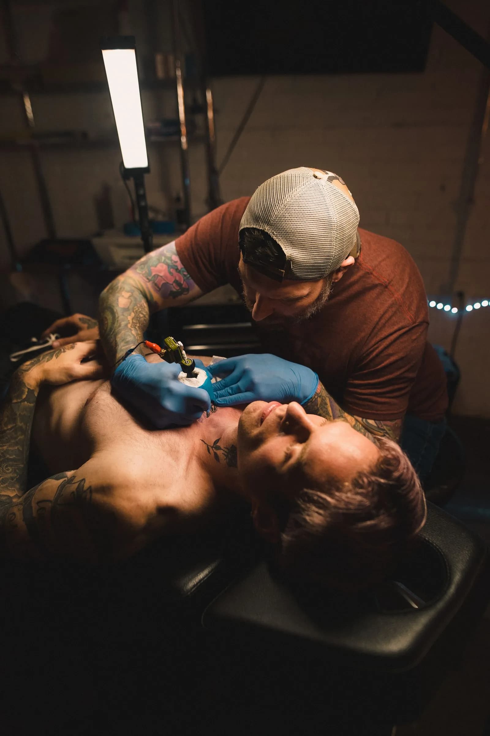 Tattoo artist working — Tattoo Shops & Tattoo Artists marketing by TML Agency