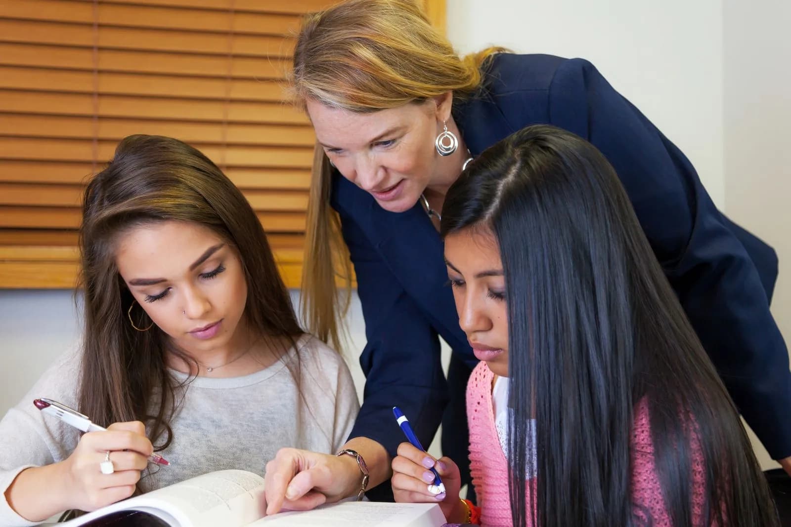 Teacher using tablet with students — Education & EdTech marketing by TML Agency