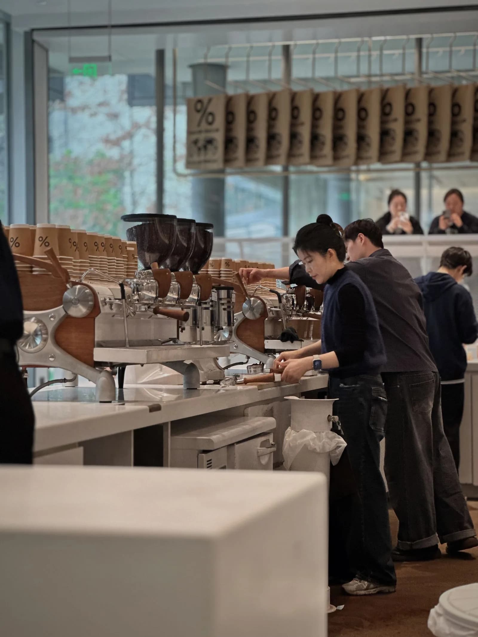 Barista making latte customer — Cafes & Coffee Shops marketing by TML Agency