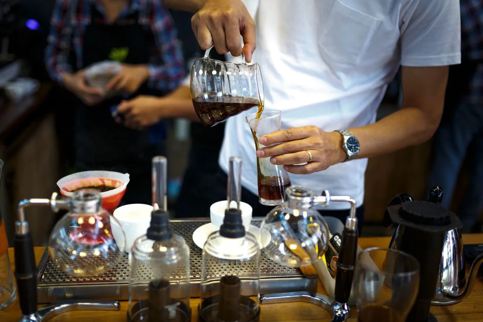 Barista pouring coffee — Cafes & Coffee Shops marketing by TML Agency