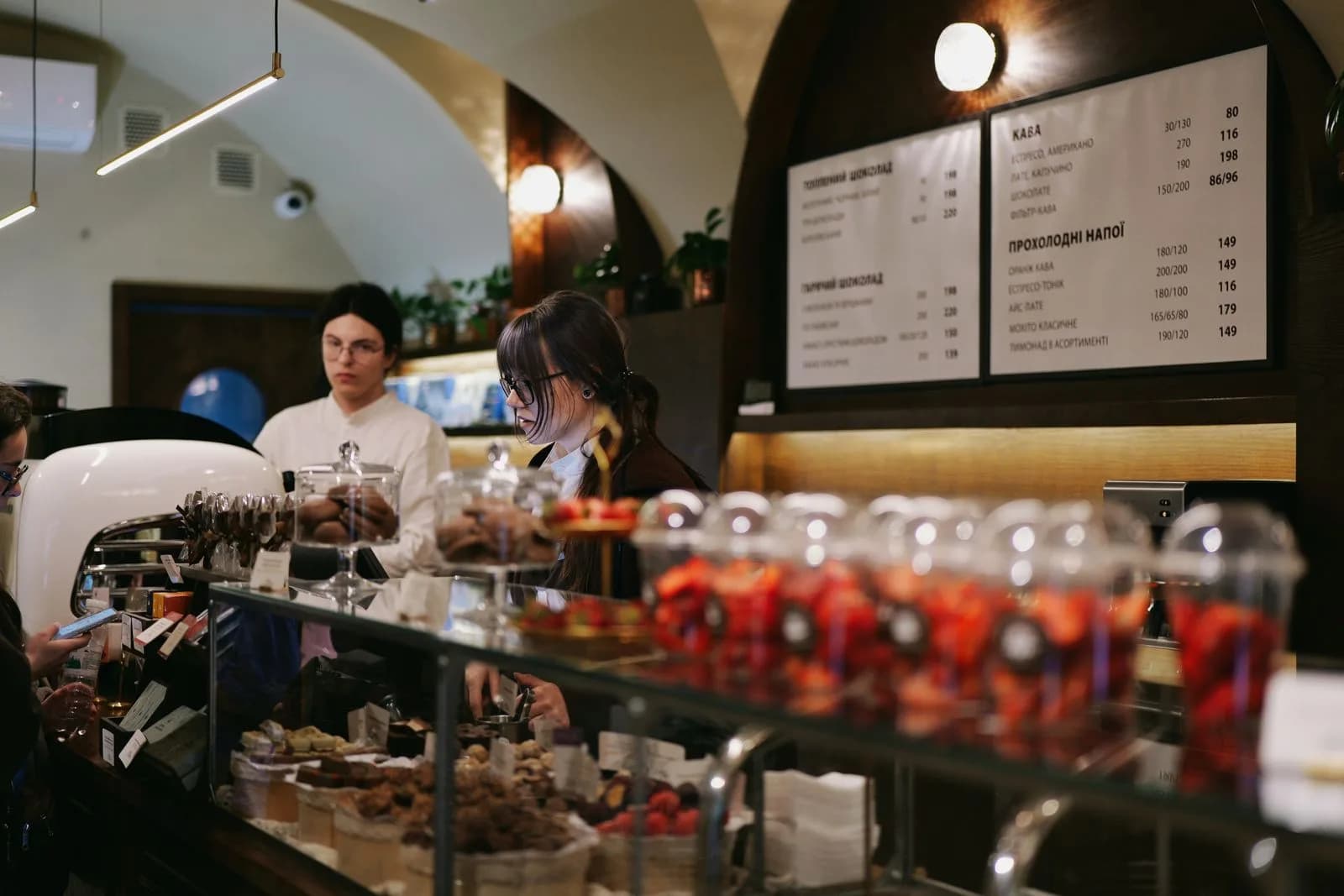 Barista serving pastry — Cafes & Coffee Shops marketing by TML Agency