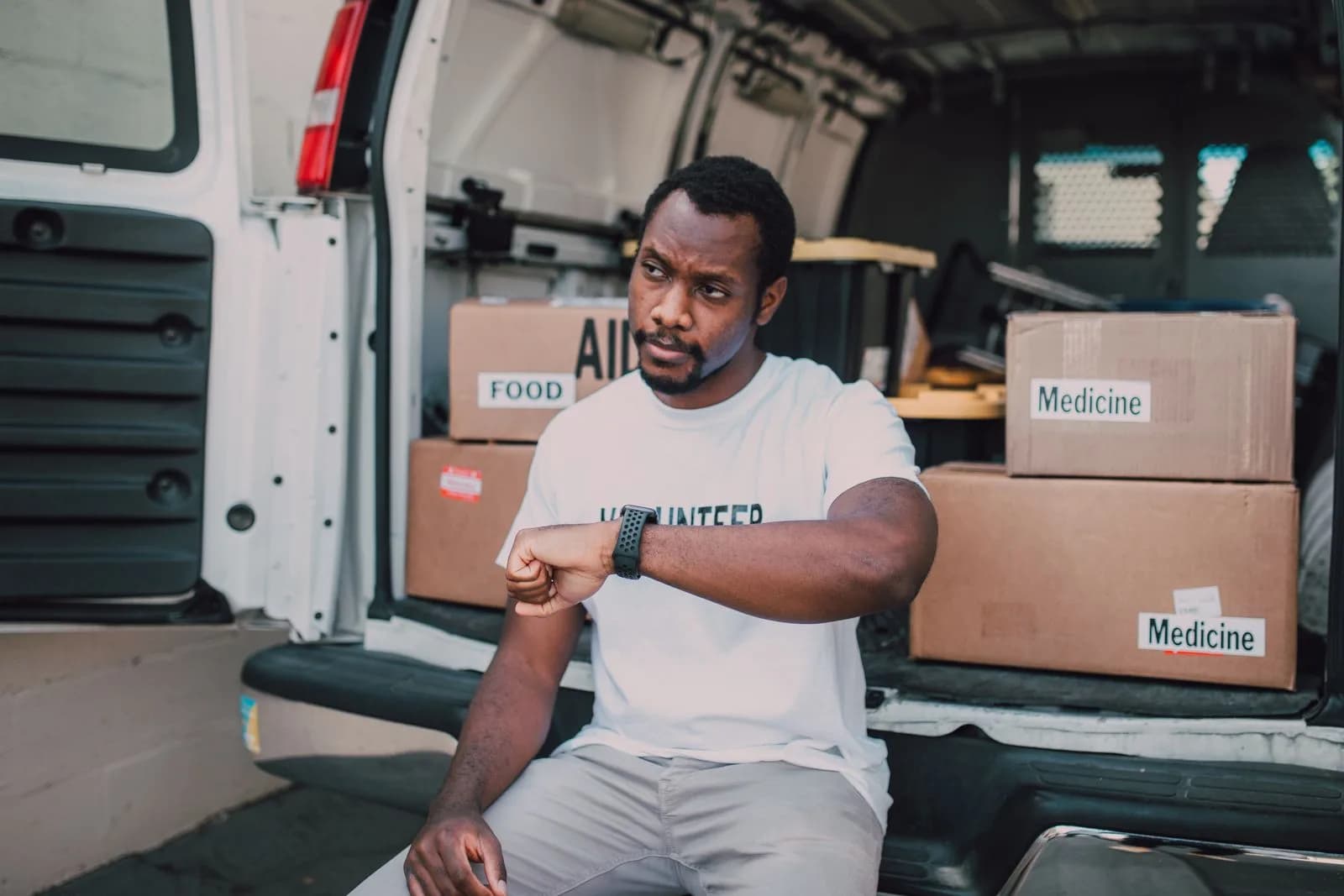 Outreach worker helping family — Churches & Non-Profits marketing by TML Agency