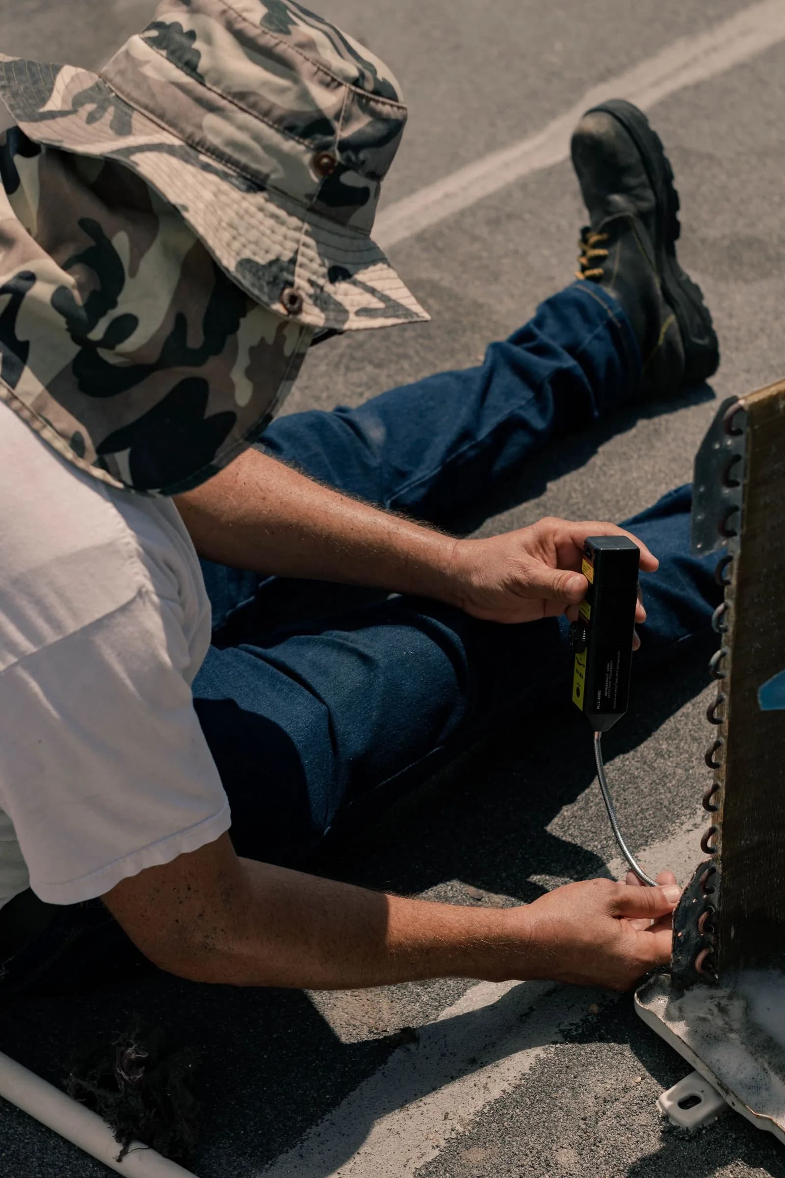 Technician servicing air conditioner — HVAC Companies & Contractors marketing by TML Agency