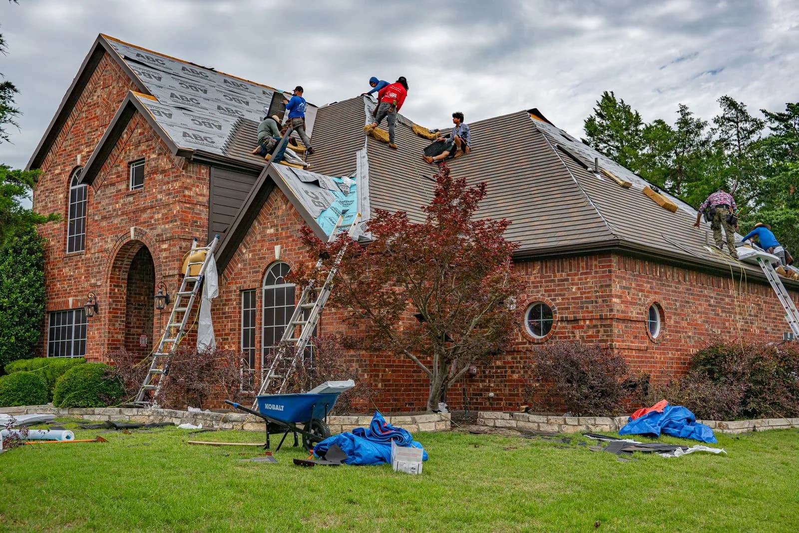 Roofer repairing roof — Roofing Companies & Contractors marketing by TML Agency