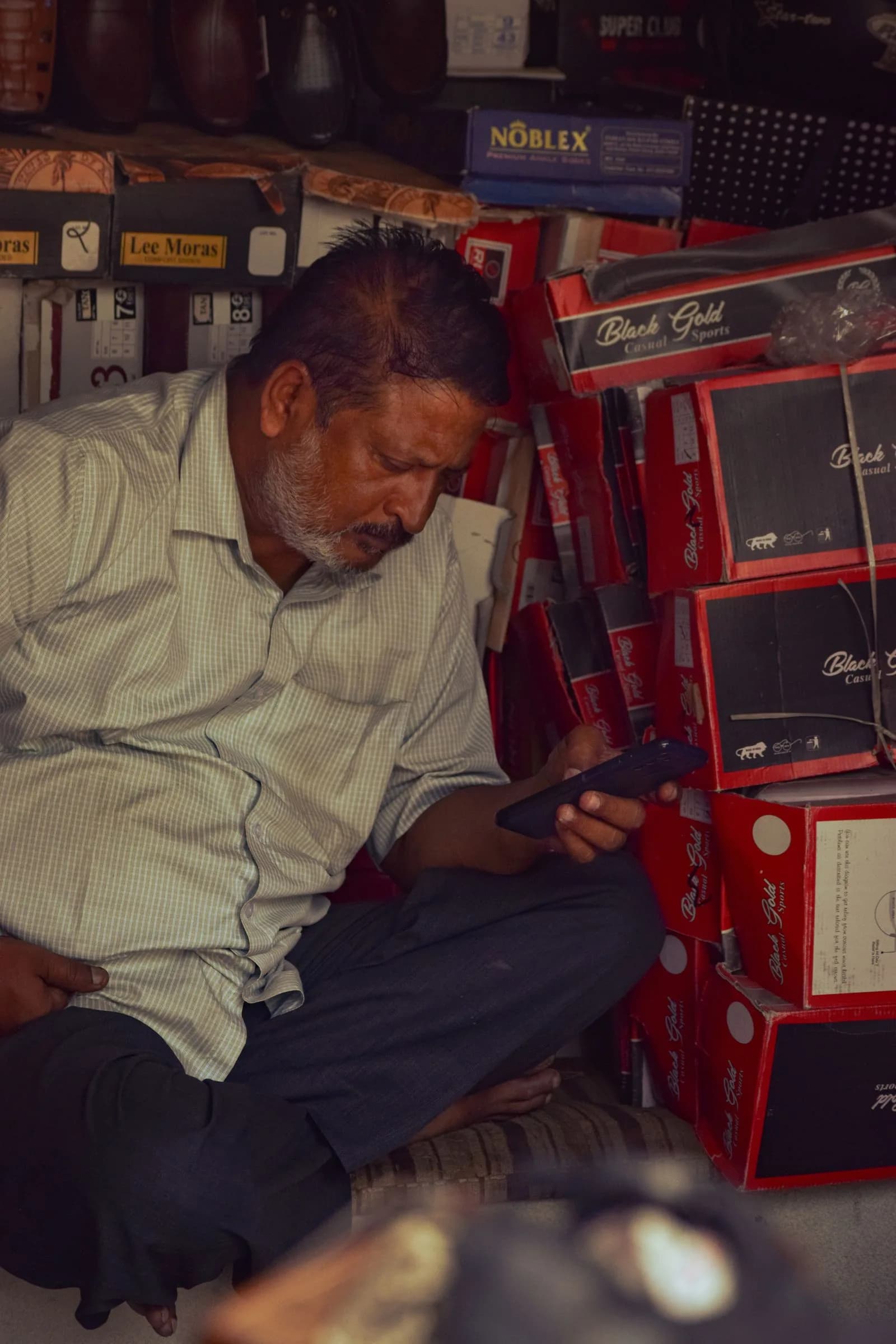 Customer mobile shopping with product — E-Commerce & D2C marketing by TML Agency