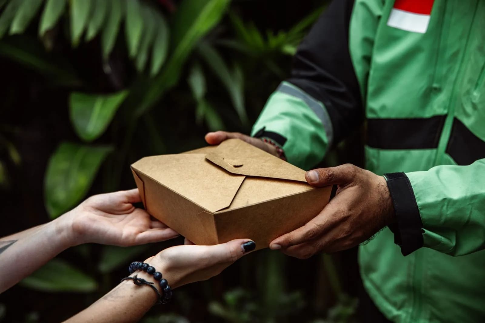 Courier handing package to customer — E-Commerce & D2C marketing by TML Agency